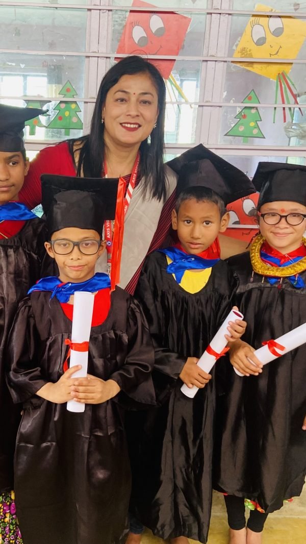 Principal Ma'am with graduating kids